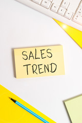 Text sign showing Sales Trend. Business photo showcasing Composite data of a company s is annual sales and employment Flat lay above table with pc keyboard and copy space paper for text messages