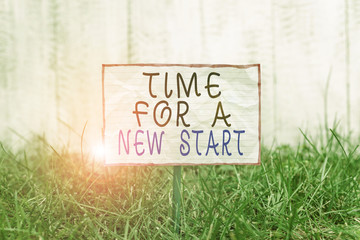 Text sign showing Time For A New Start. Business photo text Trust the magic of Beginnings Afresh Anew Rebirth Crumpled paper attached to a stick and placed in the green grassy land