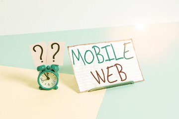 Handwriting text Mobile Web. Conceptual photo browserbased internet services accessed from handheld mobile Mini size alarm clock beside a Paper sheet placed tilted on pastel backdrop