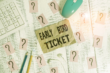 Text sign showing Early Bird Ticket. Business photo showcasing Buying a ticket before it go out for sale in regular price Writing tools, computer stuff and scribbled paper on top of wooden table