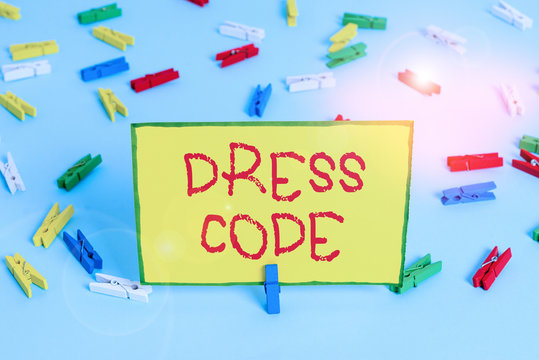 Word writing text Dress Code. Business photo showcasing an accepted way of dressing for a particular occasion or group Colored clothespin papers empty reminder blue floor background office pin