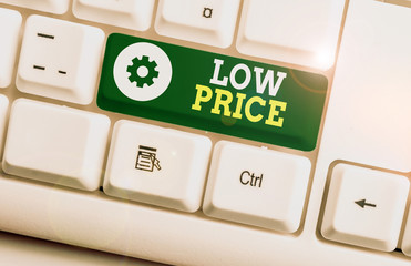 Writing note showing Low Price. Business concept for Price are the lowest in relation to other...