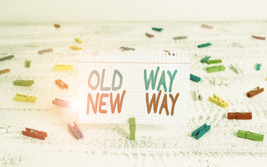 Handwriting text writing Old Way New Way. Conceptual photo The different way to fulfill the desired purposes Green clothespin white wood background colored paper reminder office supply