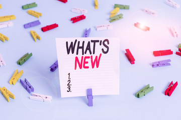 Word writing text What S Is New. Business photo showcasing Asking about latest Updates Trends and Happening News Colored clothespin papers empty reminder blue floor background office pin