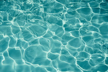 Fototapeta na wymiar Surface of blue swimming pool texture background, Water in swimming pool.