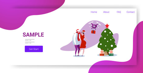 man woman in santa claus hat getting gift present box from drone delivery christmas new year holiday concept couple catching parcel shipping by air horizontal full length copy space vector