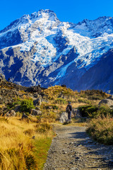 Aoraki/Mount Cook, Hooker Valley track with snowy mountain of Sefton mont against blue sky, a must Hiking Trail destination in Queenstown, New Zealand