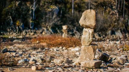 large stones on the shore a pyramid of stones