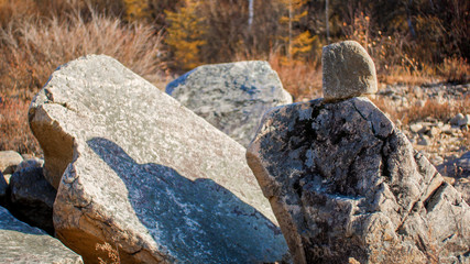 large stones on the shore a pyramid of stones