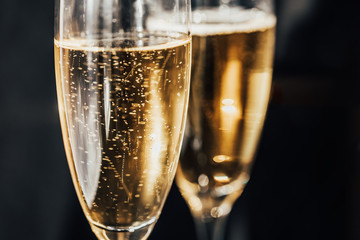 Happy New Year concept, two glasses of champagne on black background. Merry christmas.