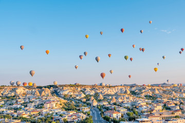 Balloon hot air over Göreme against blue sky, Cappadocia, Turkey