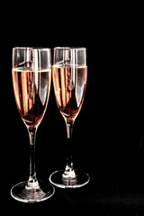 Happy New Year concept, two glasses of champagne on black background. Merry christmas.