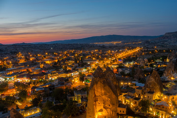 Cappadocia Panoramic nightscape during twilight of Goreme city center, located among the fairy chimney or rock formations in Nevşehir province, Turkey