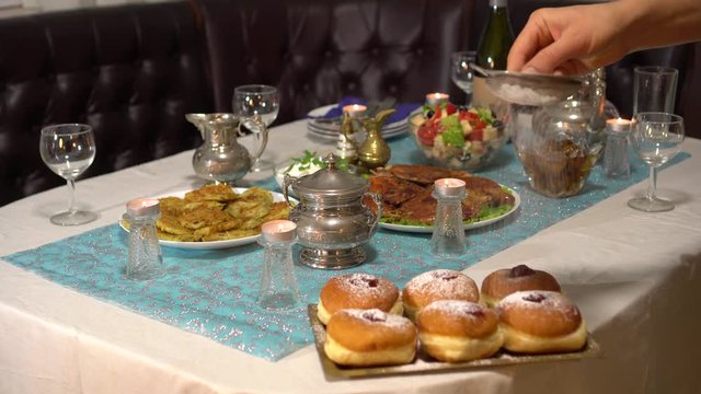 Hanukkah Food Traditions. Hanukkah Jelly Doughnuts (Sufganiyot). Family dinner