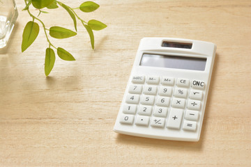 Calculator on a wooden table 