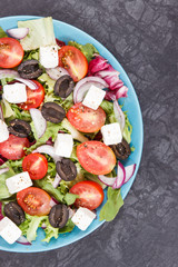 Greek salad with feta cheese and vegetables. Healthy meal as source vitamins