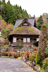 Fototapeta na wymiar Traditional Japanese house with thatched leaf