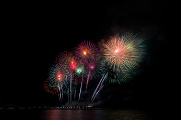 Colorful fireworks of various colors at night with celebration and anniversary concept
