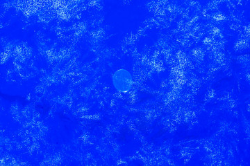 blue texture of an ice surface with pure azure water ,cold snow cryslallized wall background...
