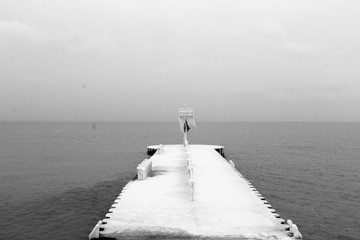 pier on the sea, frozen, snow, winter