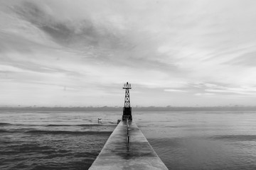 pier at sunset, cloudy sky