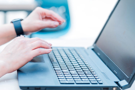 Female Hands Almost Touch Laptop Keyboard