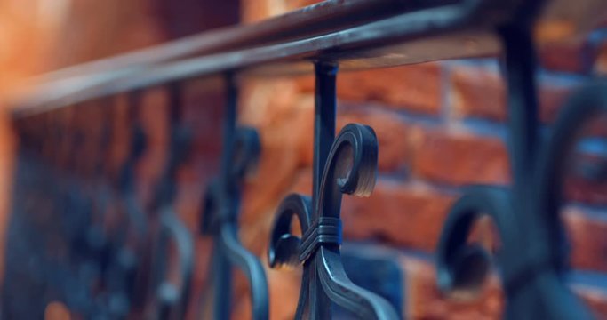 An interfloor span and a staircase with forged railing in a new brick building in the old classic style look very beautiful