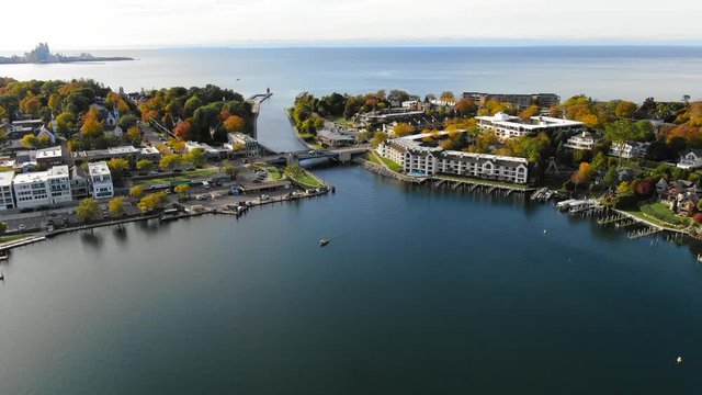 Beautiful fall landscape Small town up north in Michigan with town and boating on lake with harbor sailboats at dock The beautiful Charlevoix
