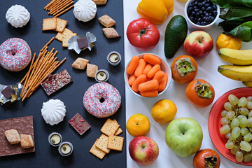 Healthy and unhealthy food concept, fruits and vegetables vs donuts, sweets and chocolate. Top view