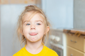 Portrait of a little smiling girl indoors