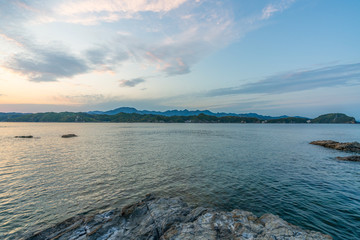 beautiful twilight sunset with blue sky high peak mountains mist fog green forest  park ocean sea idea for backpacker guiding backpacking camping campfire relax hiking  long weekend at Wakayama Japan