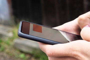 gray smartphone in man’s hands