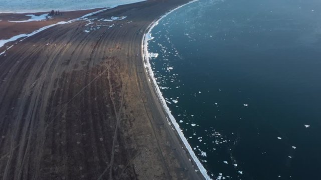 The sea coastal strip covered with ice and snow. Place of shooting northerly coast of the Bering Sea, Chukchi region, Russia.
