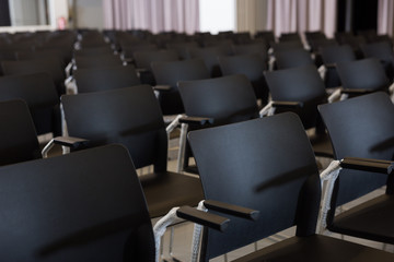 Plastic chairs in conference room