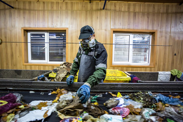 Separate garbage collection. Recycling and storage of waste for further disposal. Workers trash...