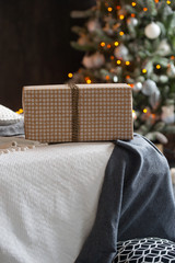 Christmas tree with white and black gifts in the bedroom Christmas. Beautifully decorated house with a silver, white and black tree and presents at Christmas. Magic time.
