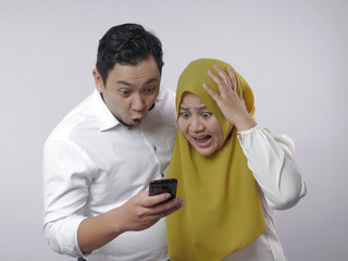 Muslim Couple Shocked and Worried to See Bad News on Phone