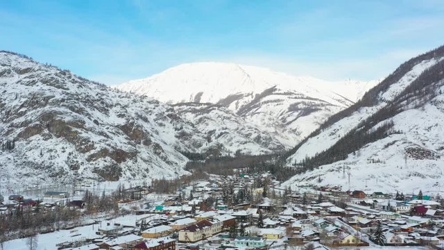 A small village located among the great mountains of Altai, filmed with a quadcopter