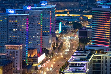 Plakat Moscow. Russia. The road in Moscow at night. Highways of Russia. Cars are driving in Moscow. A trip to the capital of Russia. Lights of the night city. Streets. City landscape view from a drone.