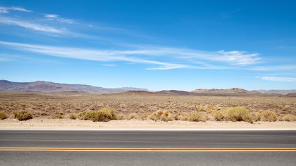 Desert road landscape in Death Valley, US.