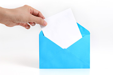 Hand holding blank card with blue envelope on white background