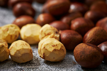 Shelled and peeled chestnuts background