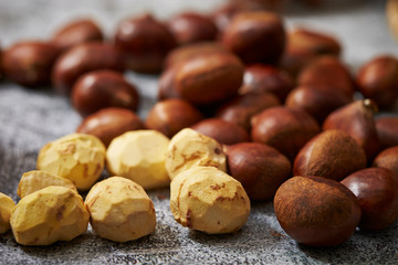 Shelled and peeled chestnuts background