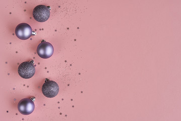 Christmas decorations on pink background. Christmas, winter, new year concept. Flat lay, top view, copy space