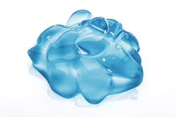 Closeup of blue hair styling gel on white background. Gel isolated on white. Hairy serum water drop