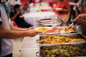 Social hunger: Volunteers provide food assistance to poor people who need food.