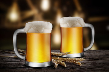 Two Glasses of Light Beer with wheat on the wooden table in the restaurant, with copy space for your text