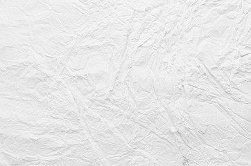 Soft light white crumpled powder background with cracks, wrinkles, random tracks.