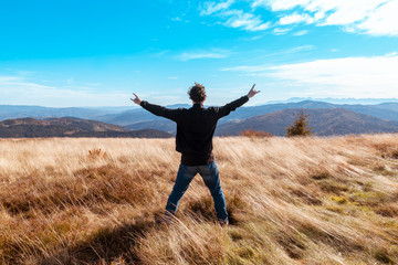 Guy enjoys warmth and mountain landscape