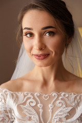 Wedding portrait. Bride with beautiful make-up and hearstyle in white wedding dress